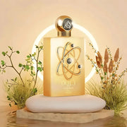 Lattafa Pride Tharwah Gold EDP 100ml perfume bottle with gold atom-style emblem on the front, next to white box packaging
