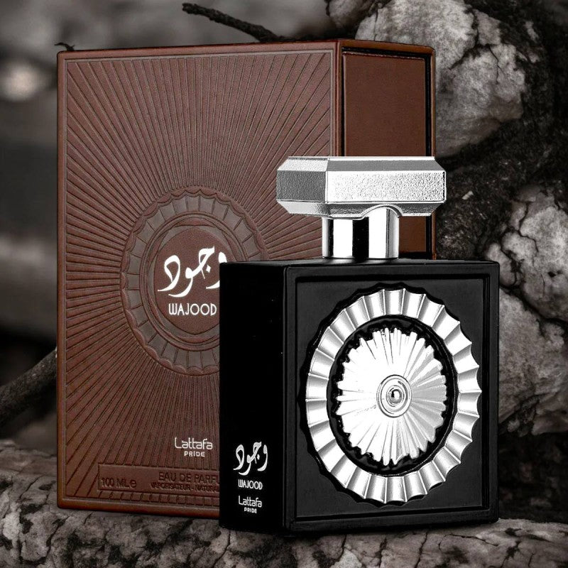 Lattafa Pride Wajood EDP 100ml black bottle with silver medallion front, next to brown box packaging
